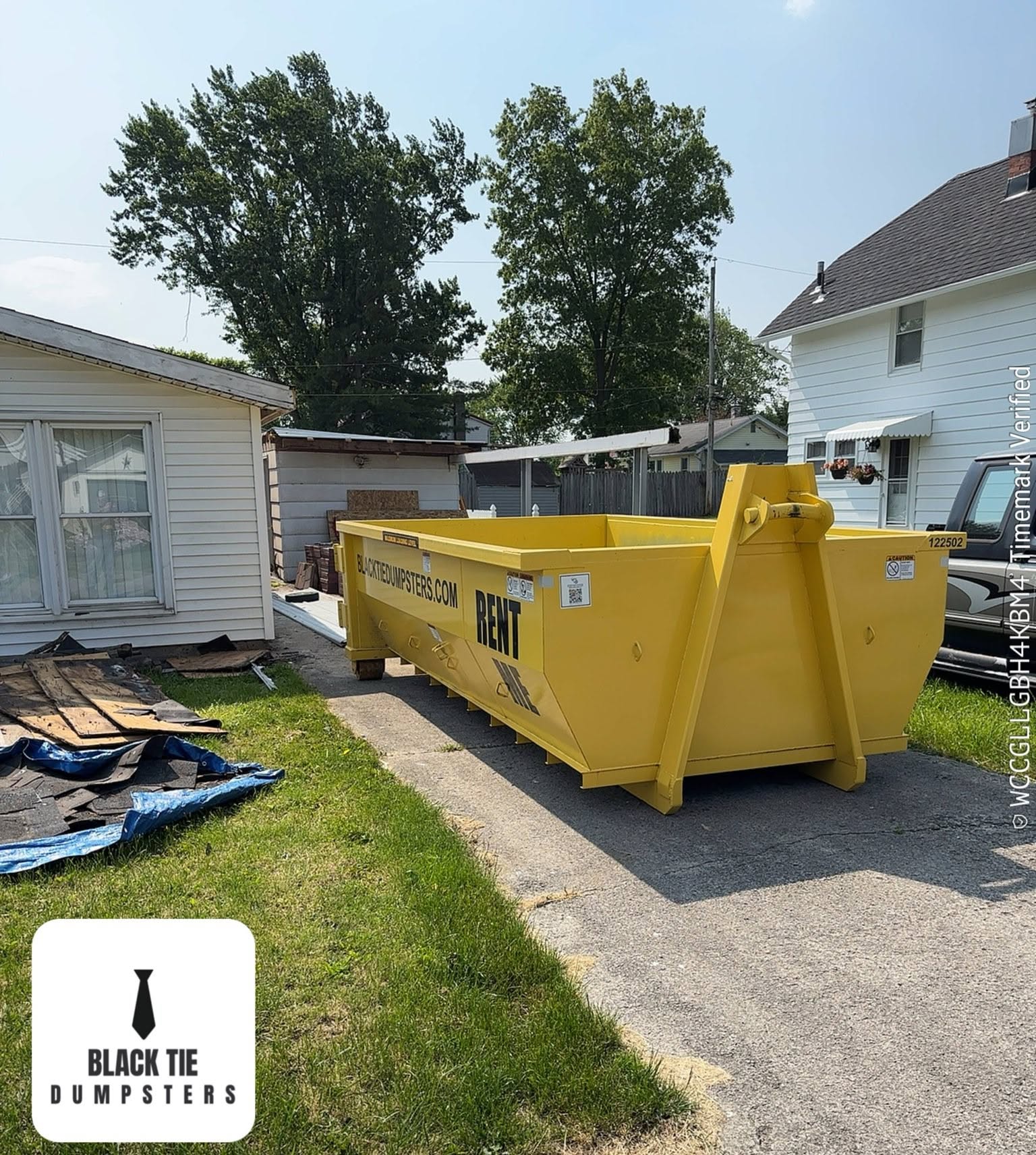 Black Tie Dumpsters dumpster placed for a residential roofing cleanout